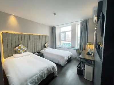 PiaoHOME Inn (Beijing Jiuxianqiao Chaoyang High-speed Railway Station) Hotel dekat Ziteng Jisong