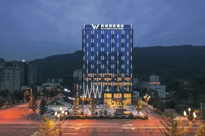 W·T INTERNATIONAL HOTEL Hotels near Tibetan Tea Village, China