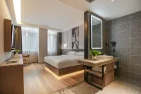 Guangzhou Jiulong Hotel (Fenggang Pedestrian Street Wisdom New City Branch) Отели в г. Фэнгана