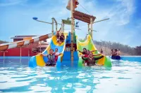 Maratha Darbar Water Park & Resort Hotels near Tilak Smarak, Dervan Hospital