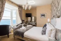 Gwesty'r Marine Hotel & Spa Отели рядом с достопримечательностью «Кумиствайт Уотерфолл»