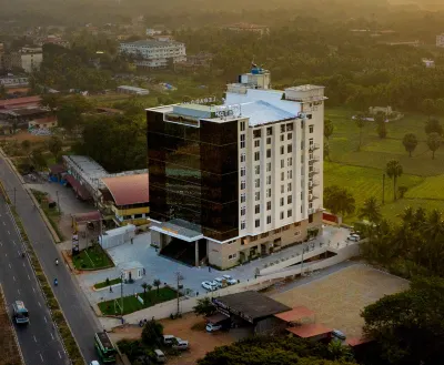 Essentia Manipal Inn Hotels near "Geetha Mandira"