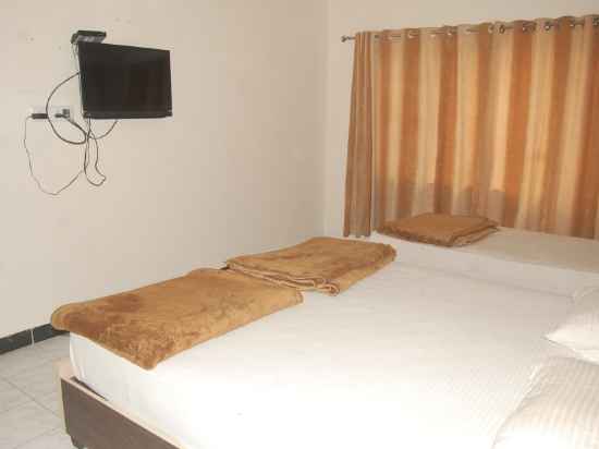 Hotel Uttam by Sky Stays Rooms