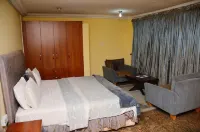 Yanna Lodge Hotels near Living Faith Church (Sabo)