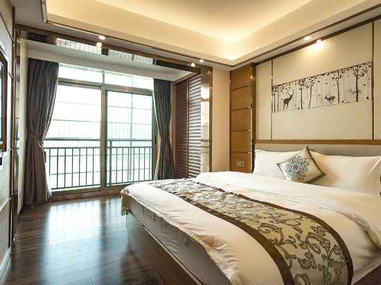 Qianbai Business Hotel Rooms