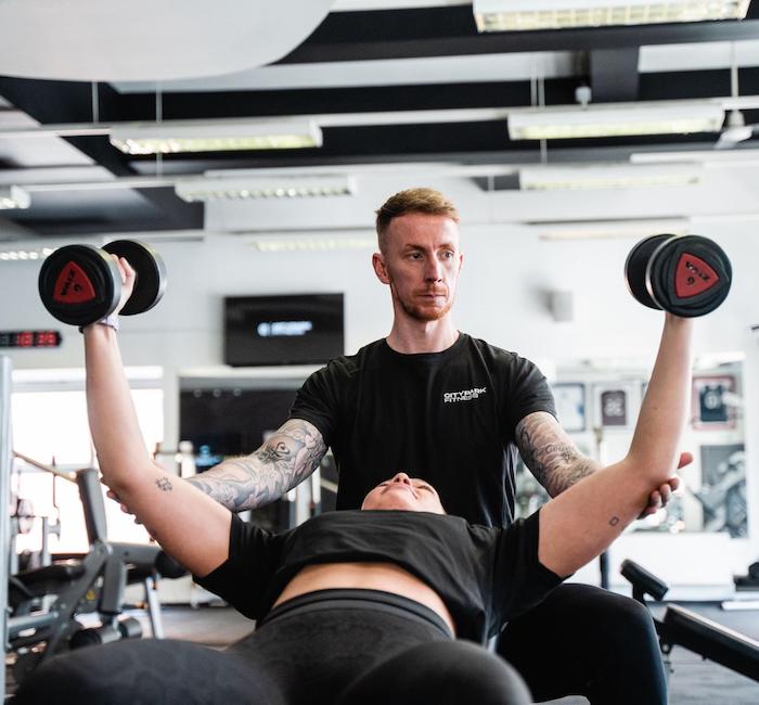 male personal trainer with female client