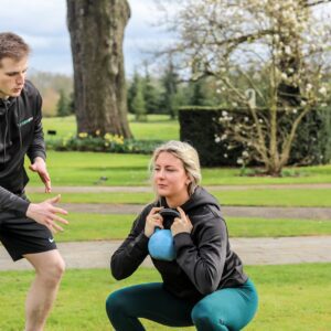 Kettlebells Students Doing Ketllebell Squat Exercises