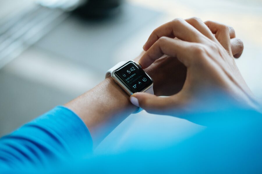 Person using best apps for personal trainers on a smartwatch.