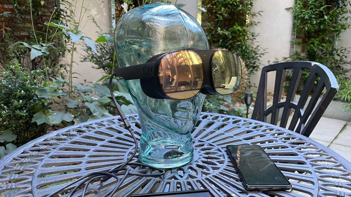 HTC Vive Flow on a glass head