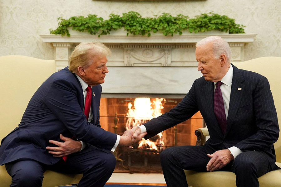 U.S. President Joe Biden shakes hands with President-elect Donald Trump in the Oval Office at the White House.