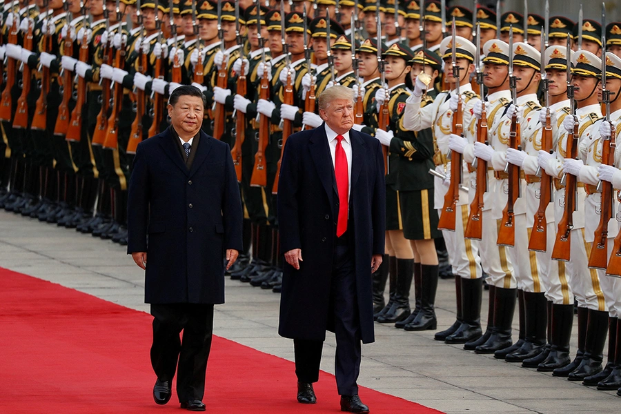 U.S. President Donald Trump takes part in a welcoming ceremony with China's President Xi Jinping in Beijing, China.