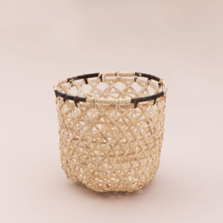 This is a beige accent piece by Jennifer Abelev called Handwoven Storage Organizer in standard.
