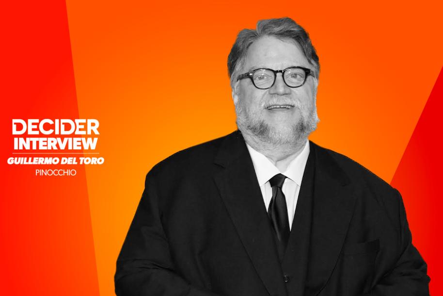 Guillermo del Toro in black and white on a bright orange background