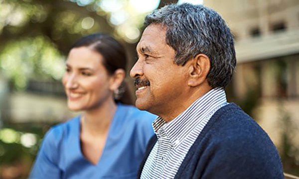 Nurse and patient outside