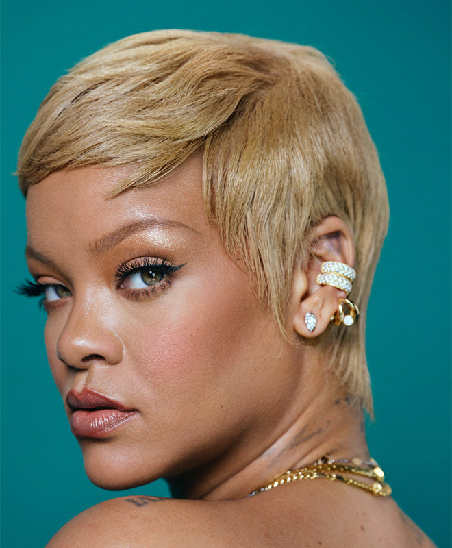 Rihanna Fenty Hair brand image against a teal background.