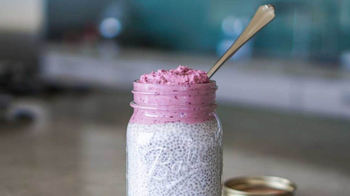 chia seed pudding in glass chair with spoon