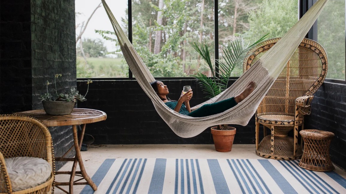 woman relaxing in hammock