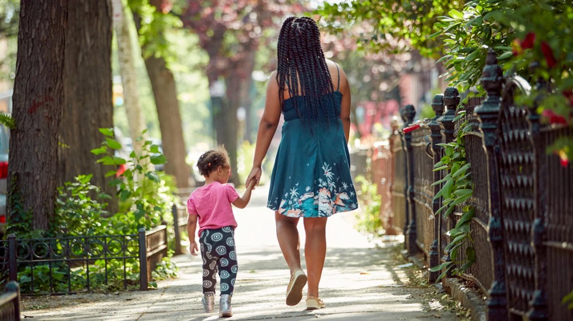 Mother walking with daughter