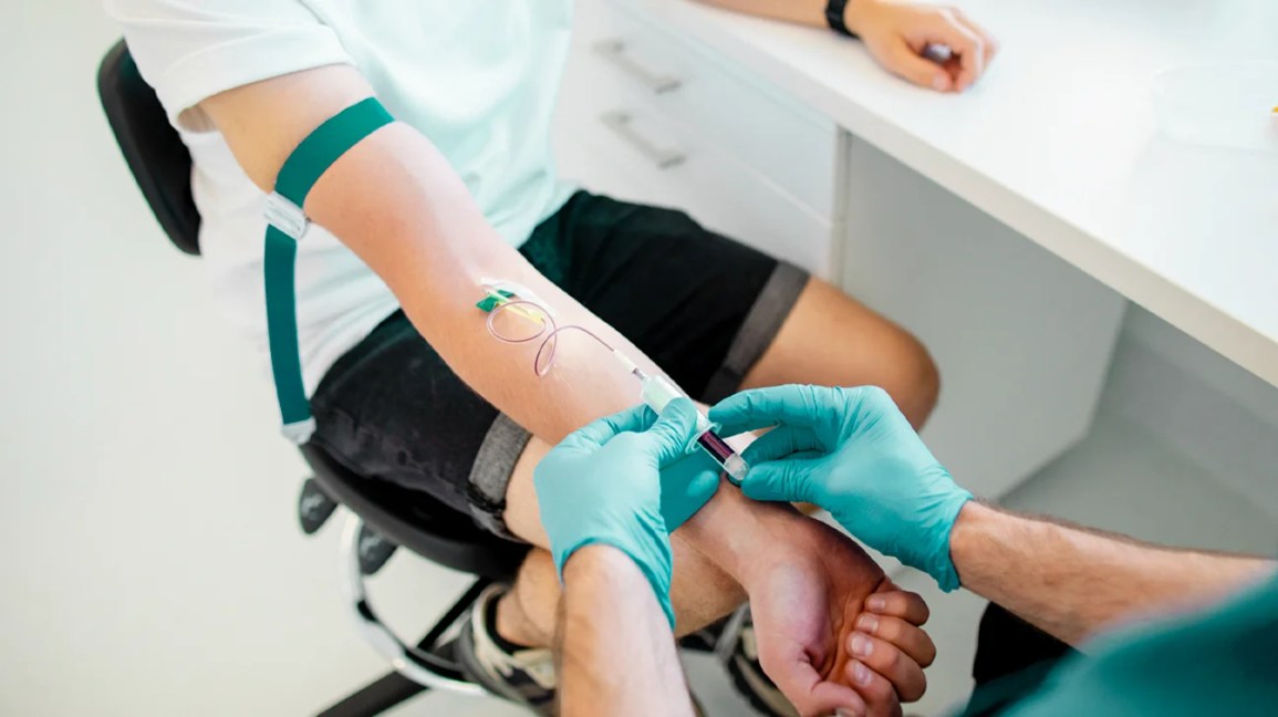 A person donates blood