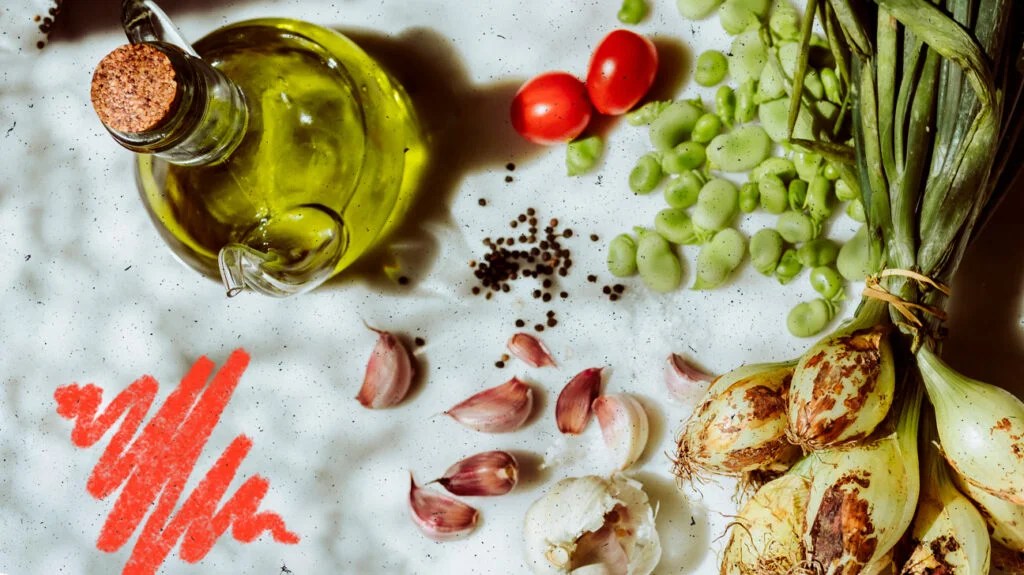 assortment of Mediterranean foods on a white tablecloth