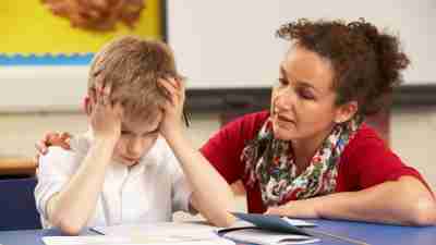 Frustrated school boy and teacher