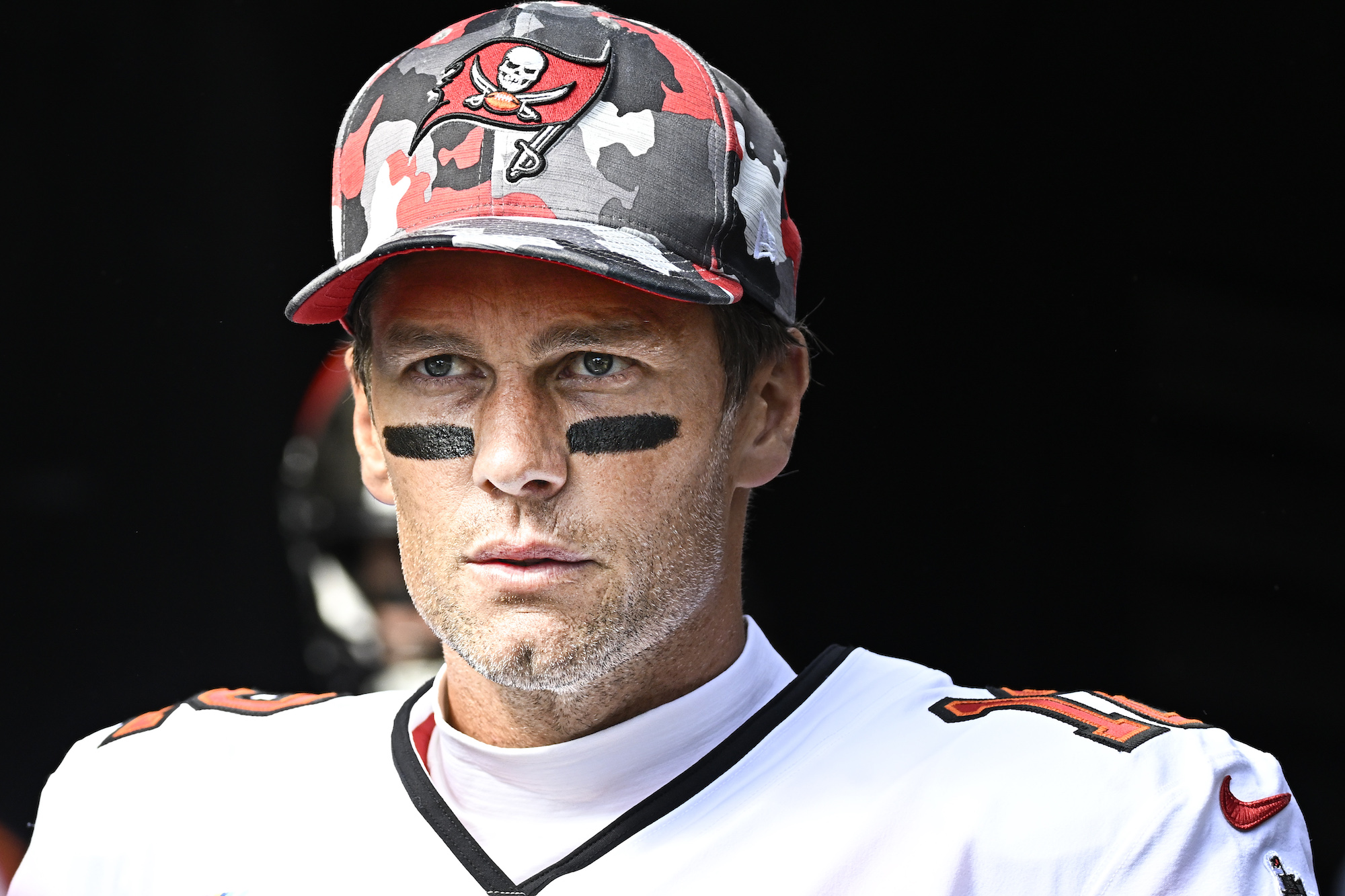 PITTSBURGH, PA - OCTOBER 16: Tampa Bay Buccaneers quarterback Tom Brady (12) looks on to the field as he enters from the tunnel before the game between the Tampa Bay Buccaneers and the Pittsburgh Steelers at Acrisure Stadium in Pittsburgh, PA on October 16, 2022. (Photo by Shelley Lipton/Icon Sportswire via Getty Images)