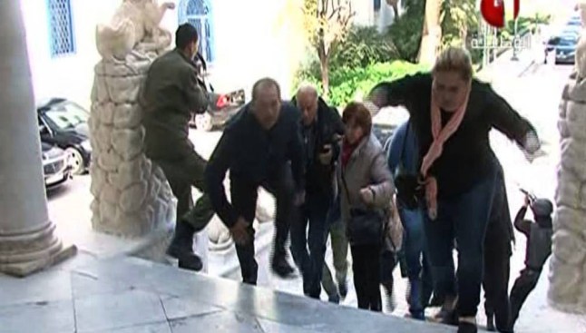 An image grab taken from the state-run Tunisia 1 channel on March 18, 2015 shows people escaping from Tunis' famed Bardo Museum during an attack by two men armed with assault rifles. Two gunmen who attacked a museum in the heart of the Tunisian capital have been killed as well as a policeman, state television said, without specifying if the incident was over.  AFP PHOTO / TUNISIA 1 == RESTRICTED TO EDITORIAL USE - MANDATORY CREDIT "AFP PHOTO / TUNISIAN 1" - NO MARKETING - NO ADVERTISING CAMPAIGNS - DISTRIBUTED AS A SERVICE TO CLIENTS ==-/AFP/Getty Images