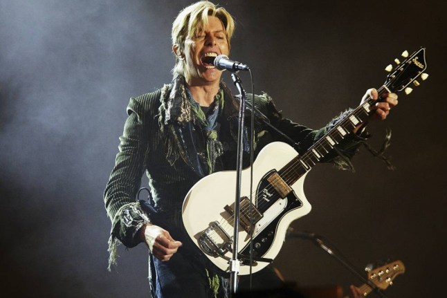 NEWPORT, ENGLAND - JUNE 13:  David Bowie performs on stage on the third and final day of "The Nokia Isle of Wight Festival 2004" at Seaclose Park, on June 13, 2004 in Newport, UK. The third annual rock festival takes place during the Isle of Wight Festival which runs from June 4-19.  (Photo by Jo Hale/Getty Images) *** Local Caption *** David Bowie