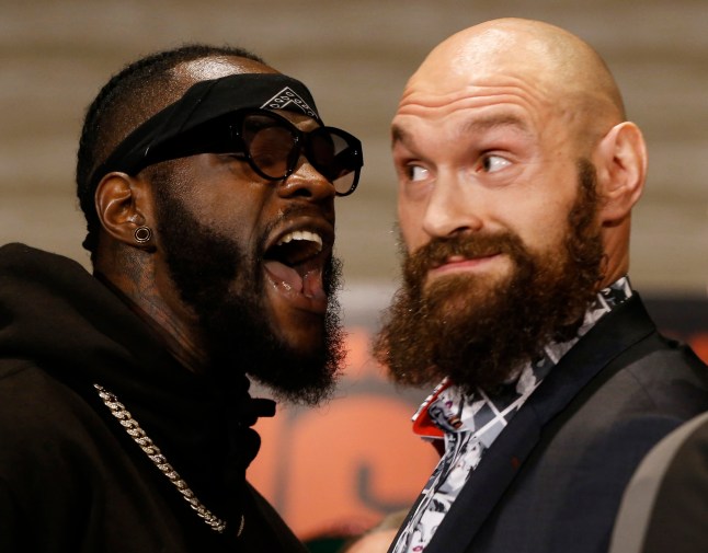 Boxers Deontay Wilder, left, and Tyson Fury exchange words as they face each other at a news conference in Los Angeles, Wednesday, Nov. 28, 2018. The pair are slated to fight Saturday night for Wilder's WBC heavyweight title. (AP Photo/Damian Dovarganes)