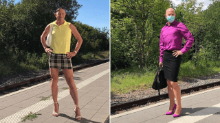 Man wearing skirt and heels at train station