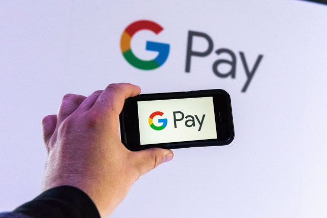 A staff shows the app during the presentation of the digital pay service of Google called 'Google Pay', in Berlin, Germany, 26 June 2018. With the 'Google Pay' App, you can manage your Credit- and Debit card and pay wireless with your mobile device. Usage of the 'Google Pay' app service starts in Germany on 26 June. Google Pay Germany Launch, Berlin - 26 Jun 2018 Mandatory Credit: Photo by Markus Heine/EPA-EFE/REX (9727600c)