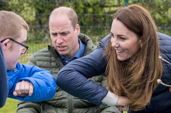 The Duke and Duchess of Cambridge elbow bumping during a visit to the Cheesy Waffles Project at the Belmont Community Centre in Durham. Picture date: Tuesday April 27, 2021. PA Photo. The charity for children, young people and adults with additional needs across County Durham, is one of the charitable organisations that benefitted from donations given around the royal couple's wedding. Photo credit should read: Andy Commins/Daily Mirror/PA Wire