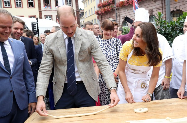 File photo dated 20/07/17 of the Duke and Duchess of Cambridge attempting to make pretzels during a tour of a traditional German market in the central square of Heidelberg, Germany. The Duchess of Cambridge will have spent a decade as an HRH when she and the Duke of Cambridge mark their 10th wedding anniversary on Thursday. Issue date: Wednesday April 28, 2021. PA Photo. See PA story ROYAL Kate 10Photos. Photo credit should read: Chris Jackson/PA Wire