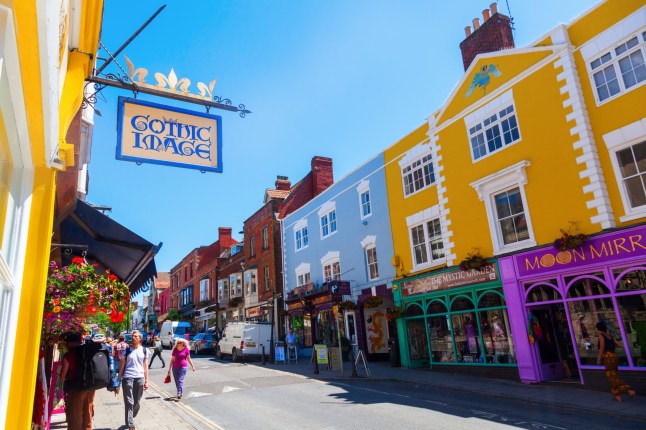 GLASTONBURY, ENGLAND - JUNE 30, 2015: street view of Glastonbury, Somerset, with unidentified people. It has been described as a New Age community, notable for myths and legends concerning King Arthur; Shutterstock ID 300863606; dept: -; Name: -; job: -; page/date: -