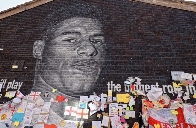 Mandatory Credit: Photo by Andy Von Pip/ZUMA Press Wire/REX/Shutterstock (12220385f) Mural of England Footballer Marcus Rashford and messages of support after it was defaced following his penalty miss in the final of the European Football Championships 2021. He also received racist abuse online. Mural of England And Manchester United footballer Marcus Rashford , Withington,Manchester , UK - 16 Jul 2021