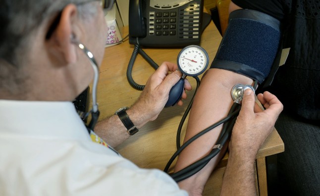 File photo dated 10/09/14 of a GP checking a patient's blood pressure. Fewer than 60% of GP appointments in England were conducted face-to-face last month, new figures show. Experimental data from NHS Digital, published on Thursday, shows 58% of appointments were carried out face-to-face in August, the first full month since most legal restrictions were lifted in England. Issue date: Thursday September 30, 2021. PA Photo. See PA story HEALTH GPs. Photo credit should read: Anthony Devlin/PA Wire