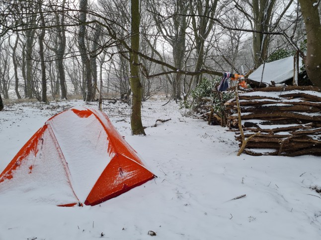 Christian Lewis and his tent in snow