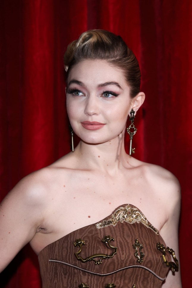 MILAN, ITALY - FEBRUARY 24: Gigi Hadid poses backstage of the Moschino fashion show during the Milan Fashion Week Fall/Winter 2022/2023 on February 24, 2022 in Milan, Italy. (Photo by Vittorio Zunino Celotto/Getty Images)