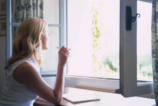 Woman Writing by Window