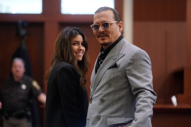 Actor Johnny Depp and his attorney Camille Vasquez look on during Depp's defamation case against ex-wife, actor Amber Heard at Fairfax County Circuit Court in Fairfax, Virginia, U.S., May 19, 2022. Shawn Thew/Pool via REUTERS