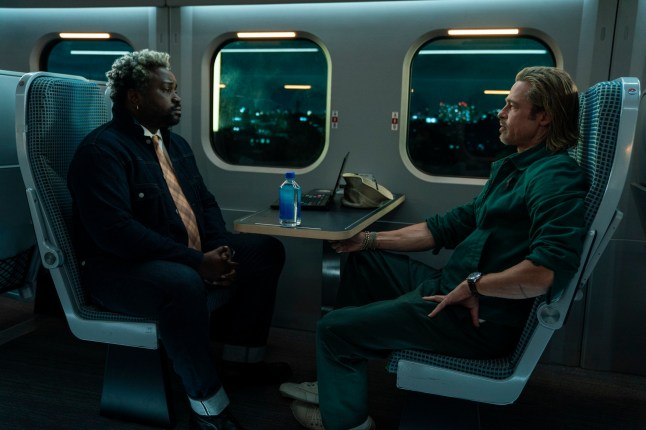 This image released by Sony Pictures shows Bryan Tyree Henry, left, and Brad Pitt in a scene from "Bullet Train." (Scott Garfield/Sony Pictures via AP)