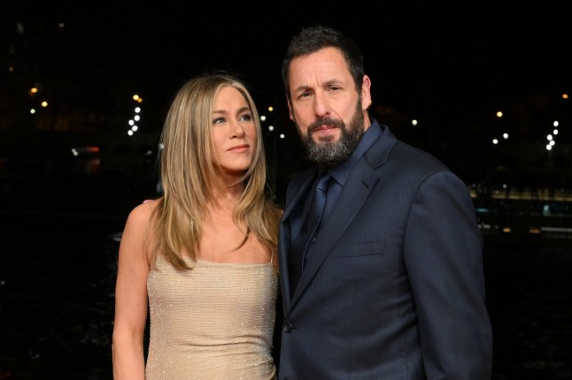 PARIS, FRANCE - MARCH 16: Jennifer Aniston and Adam Sandler attend the "Murder Mystery 2" photocall at Pont Debilly on March 16, 2023 in Paris, France. (Photo by Stephane Cardinale - Corbis/Corbis via Getty Images)