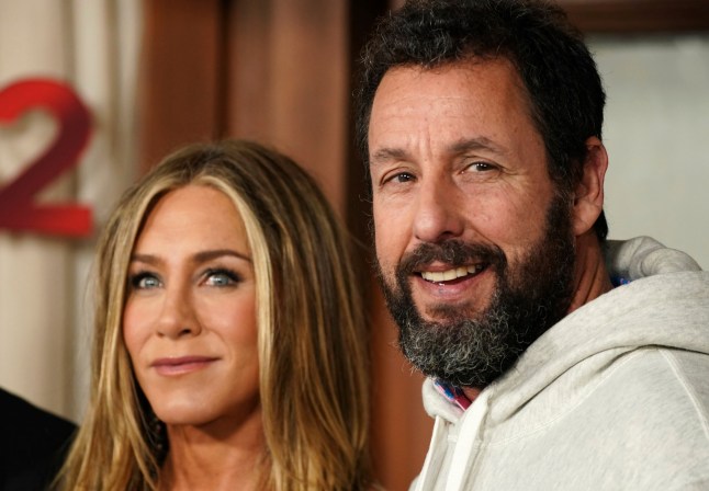 Jennifer Aniston, left, and Adam Sandler arrive at the premiere of "Murder Mystery 2" on Tuesday, March 28, 2023, at the Regency Village Theatre in Los Angeles. (Photo by Jordan Strauss/Invision/AP)