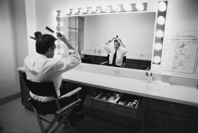 (FILE PHOTO) TV Host Jerry Springer Dies Aged 79 Ex-mayor/news anchorman/talk show host Jerry Springer brushing his hair while ditting in front of dressing rm. mirror before taping The Jerry Springer Show backstage at NBC studios. (Photo by Steve Kagan/Getty Images)