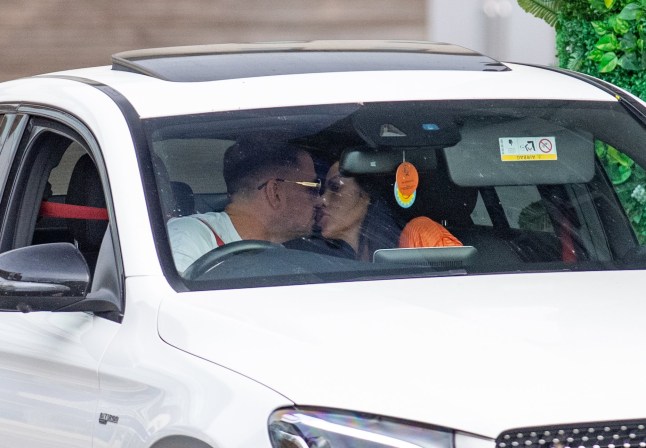 30 June 2023 - EXCLUSIVE. Katie Price and on off boyfriend Carl Woods appear to be back on again after his trip to Las Vegas. Carl was pictured with a blonde woman on his trip to Vegas which angered Katie who reacted with a instagram story slagging the woman off. Katie was seen today being dropped at a salon in Sussex with her daughter Bunny. The couple shared a kiss, before exiting the car which ironically has a Vegas as its number plate! Credit: GoffPhotos.com Ref: KGC-102 **Exclusive to GoffPhotos.com - Newspapers Allrounder - Magazines Double Space Rates Minimum Fee of ??350 - Online/Web Must Call Before Use - ONLINE EMBARGOED UNTIL 18:30 01/07/23**