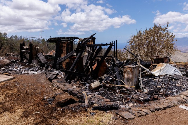 A view of the remains of a residential home after it was destroyed during the wildfires, in Kula on Maui island, Hawaii, U.S., August 13, 2023. REUTERS/Mike Blake