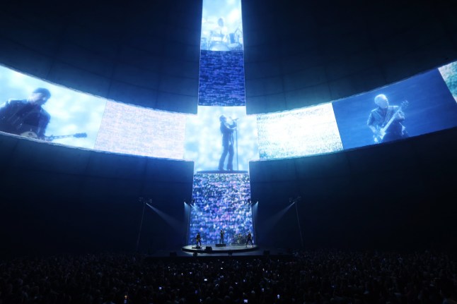 LAS VEGAS, NEVADA - SEPTEMBER 29: (Exclusive Coverage) Bono, The Edge, Adam Clayton and Bram van den Berg of U2 perform during opening night of U2:UV Achtung Baby Live at Sphere on September 29, 2023 in Las Vegas, Nevada. (Photo by Kevin Mazur/Getty Images for Live Nation)