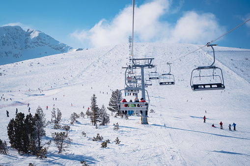 Chair lift in the ski resort of Bansko, Bulgaria. Winter landscape in the Pirin mountains