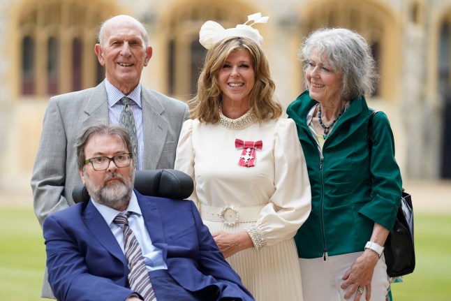 WINDSOR, ENGLAND - JUNE 28: Kate Garraway, with her husband Derek Draper and her parents Gordon and Marilyn Garraway, after being made a Member of the Order of the British Empire for her services to broadcasting, journalism and charity by the Prince of Wales during an investiture ceremony at Windsor Castle, on June 28, 2023 in Windsor, England. (Photo by Andrew Matthews - Pool/Getty Images)