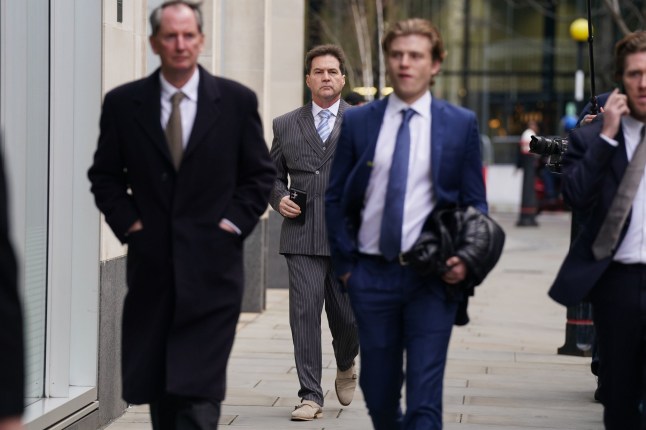 Dr Craig Wright (centre) arrives at the Rolls Building in London for a hearing over the identity of the creator of Bitcoin. The hearing is being held to determine whether or not computer scientist Dr Wright is the pseudonymous "Satoshi Nakamoto" - the person who created the digital currency in 2008. Wright, an Australian inventor and academic, said he was Bitcoin's creator in 2016 but the claim has drawn scepticism. Picture date: Monday February 5, 2024. PA Photo. See PA story COURTS Bitcoin. Photo credit should read: Lucy North/PA Wire